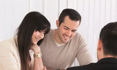 man and woman in meeting with another man