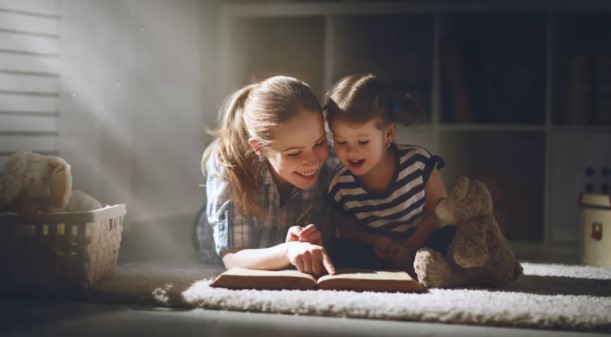 Carer and child reading